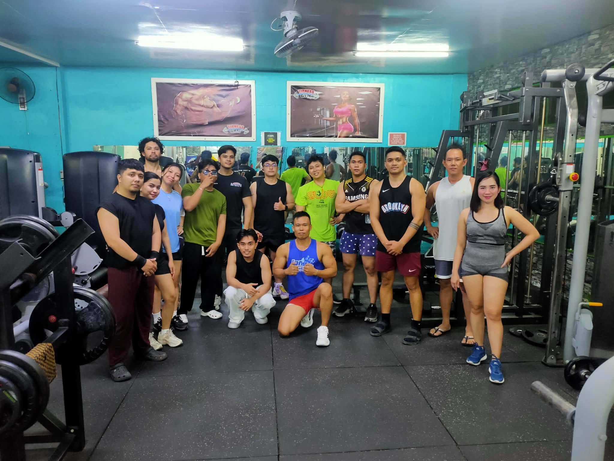 The crew gathered on the rubber gym floor
